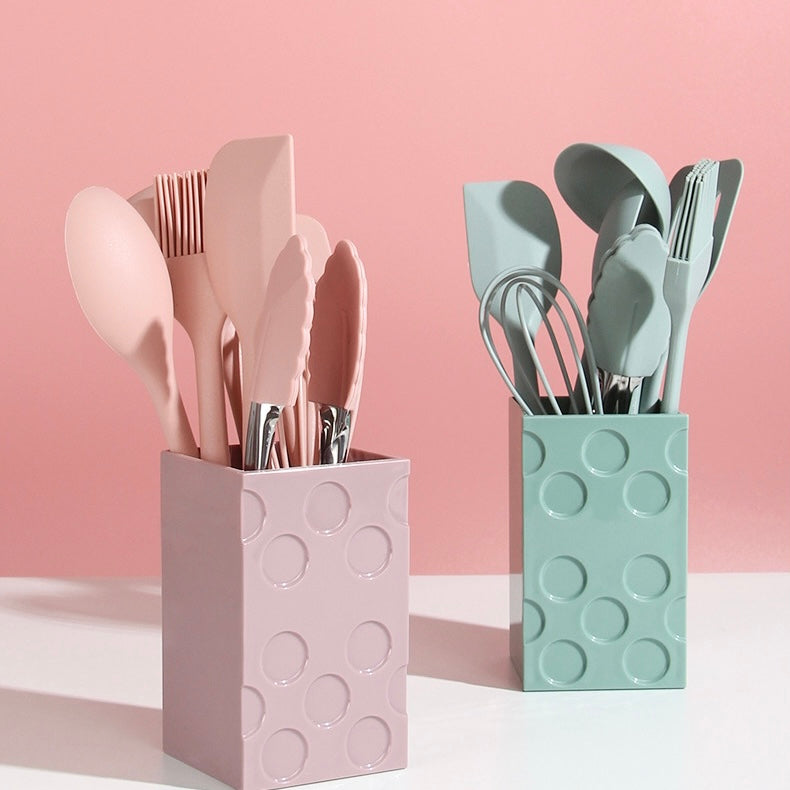 Premium Photo  Pink kitchen utensils on blue, home kitchen tools